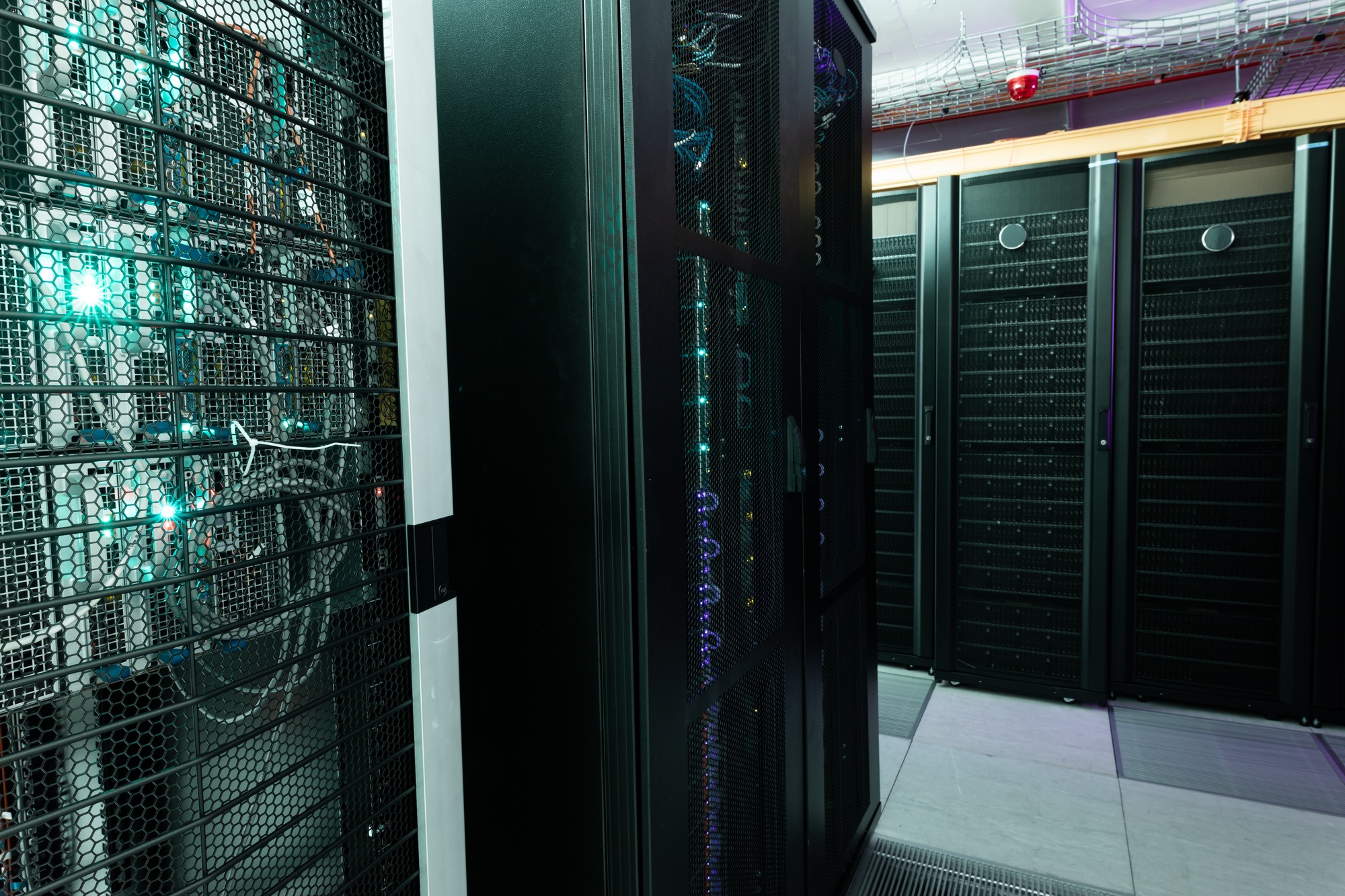 Data center with multiple rows of fully operational server racks